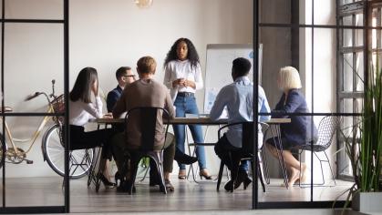 Woman presenting to colleagues