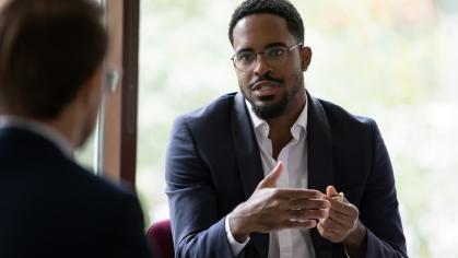 Man explaining something to colleague