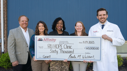 Rutgers H.O.P.E. Clinic director, Frank Giannelli (right), accepts a $60,000 check donation on April 19 from the Affinity Foundation, the nonprofit organization of Affinity Federal Credit Union. The gift allows clinic officials to expand primary health care services for underserved populations across central New Jersey. (R) Frank Giannelli, Jr. trustee, Affinity Foundation; MaryAnne Melanson, trustee, Affinity Foundation; Kawanzaa King, trustee, Affinity Foundation; Karla Wallack, executive director, Affini