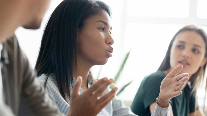 Woman talking to colleagues