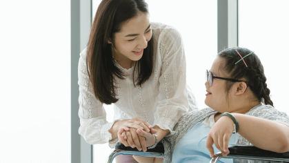 Woman with girl in wheelchair