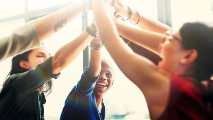 Group of women smiling and celebrating