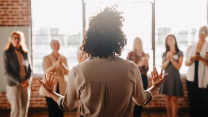 Woman presenting in front of a group