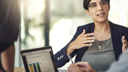 Woman speaking to a colleague