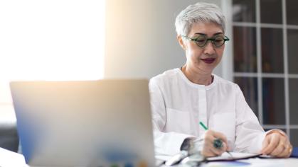 Woman writing down notes