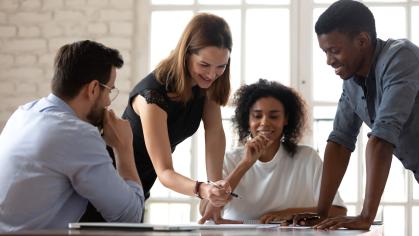 Colleagues working together to solve a problem