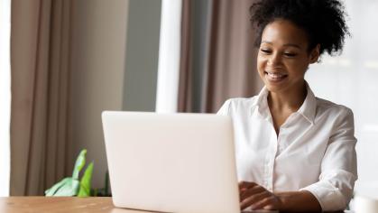 Woman typing on laptop