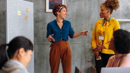 Women collaborating on a presentation