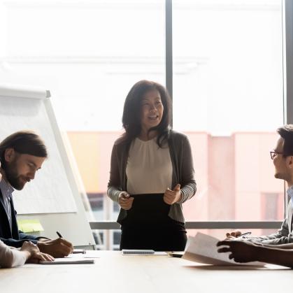 Woman presenting to colleagues