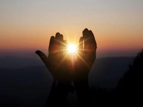 sunlight cusped in hands